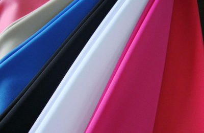 What kind of fabric is spandex and what are its advantages and disadvantages